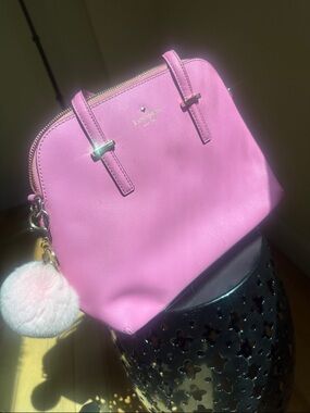 kate spade pink dome satchel with pom-pom charm